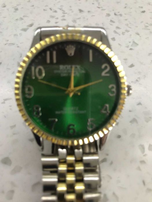 Rolex oyster perpetual day date quartz water resistant