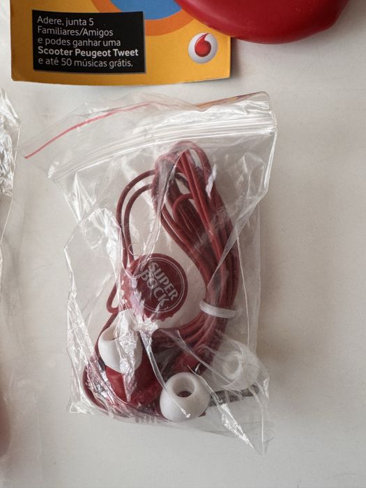 Merchandising abre capsulas coke auriculares super bock porta chaves