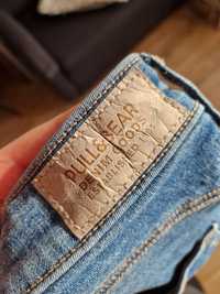 Niebieskie jeansy z dziurami pull&bear