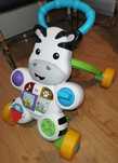 Pchacz chodzik jeździk Zebra Fisher Price interaktywna