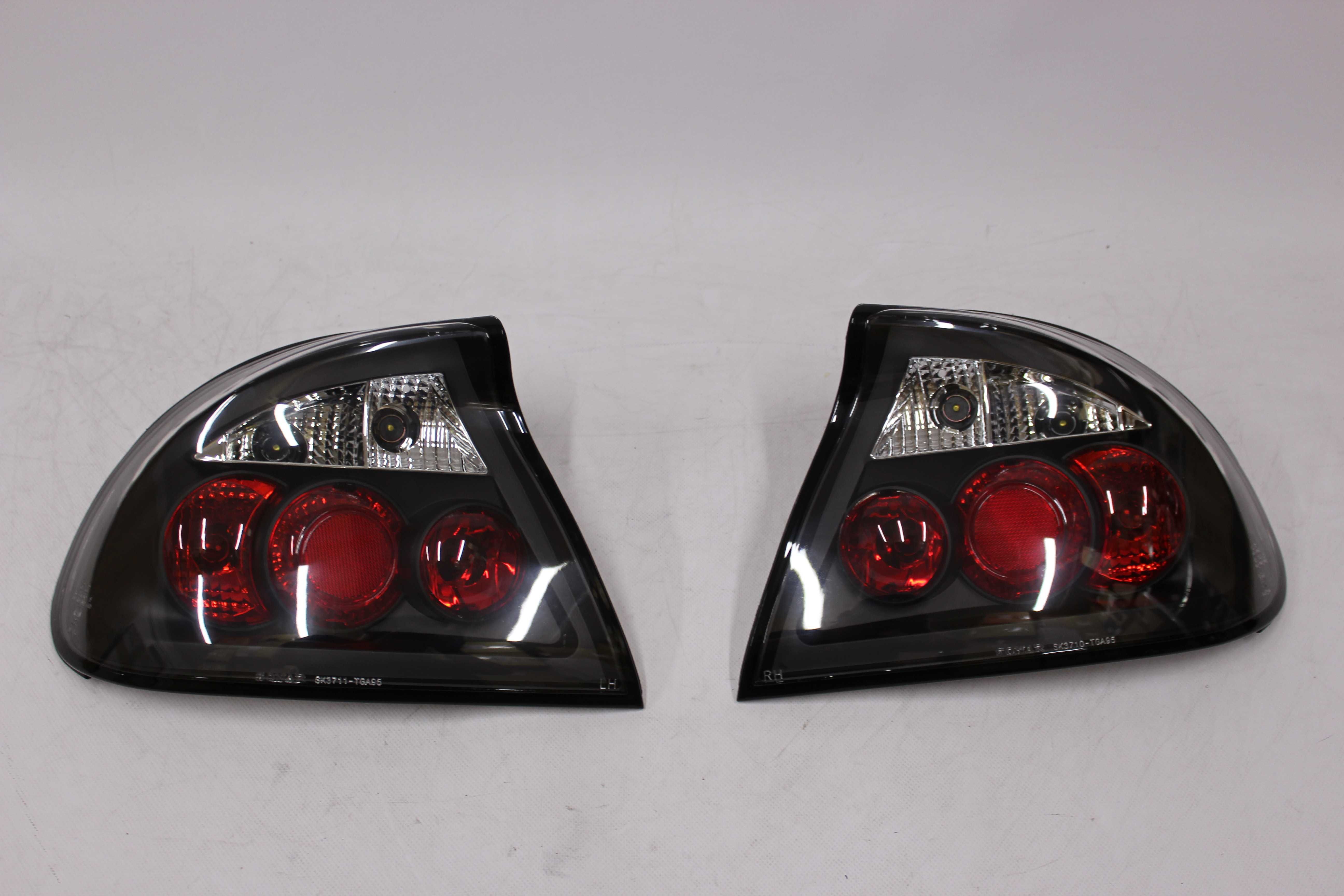 Lampy światła tył tylne OPEL TIGRA 94-00 Black TUNING SMOKE NOWE