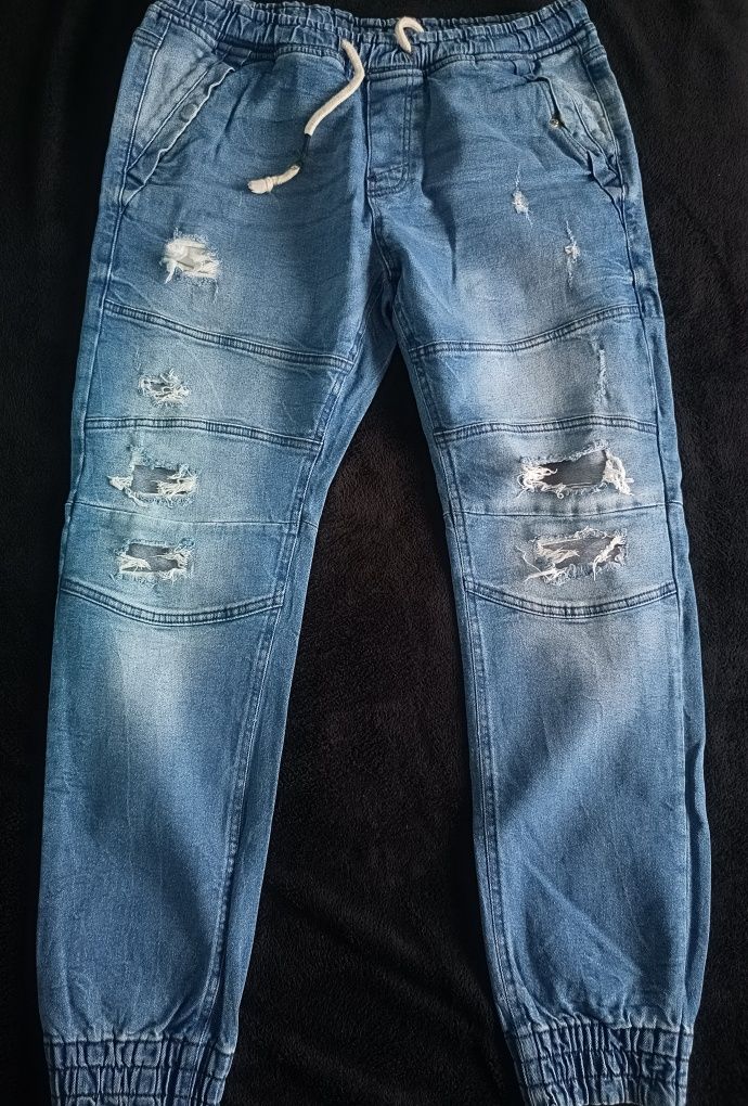 SINSAY spodnie jogger z przetarciami rozm. 34