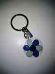 SALDOS - Porta-chaves flor Benetton, NOVO. OFERTA DE NATAL