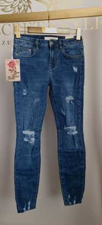 Elastyczne jeansy z dziurami niebieskie M 38 Re-dress