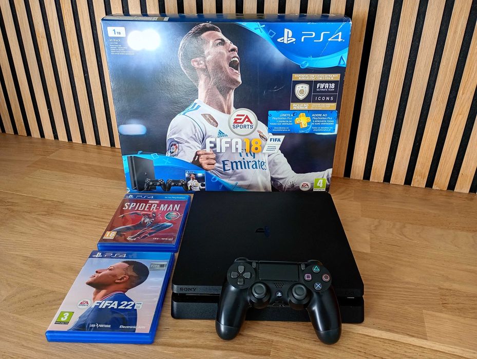 PS4 1TB na caixa com comando e jogos