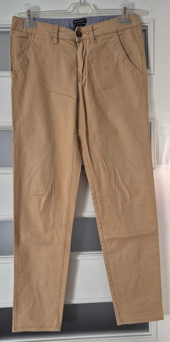 H&M beżowe bawełniane spodnie chłopięce roz 170
