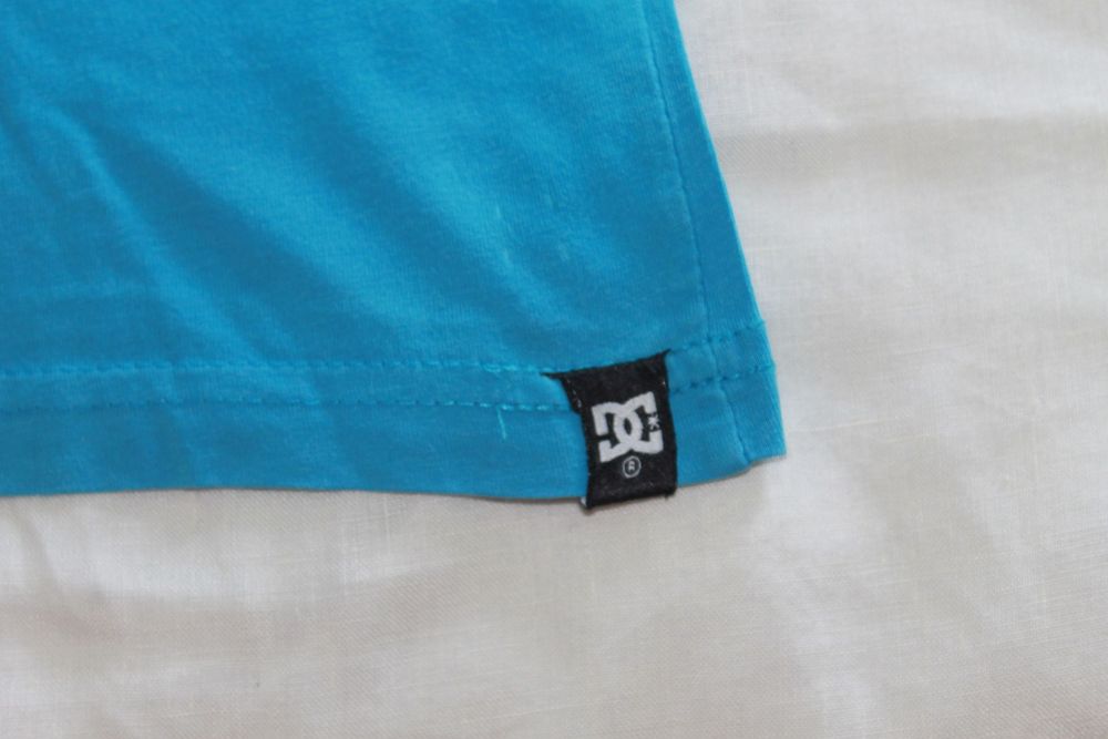 t-shirt azul e verde DC