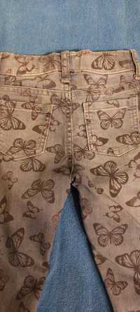 Spodnie dżinsowe w motylki 128