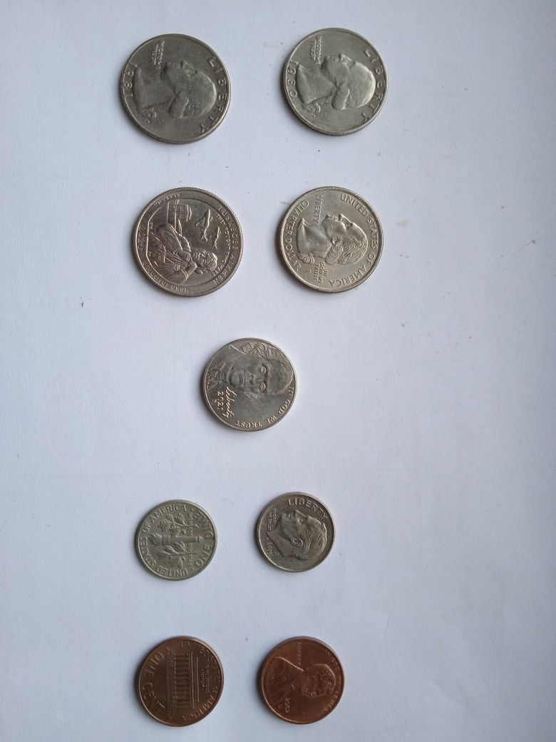 Монети США і один цент Канади 1976року.