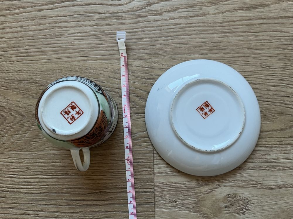 Chávena de café e pires motivos orientais
