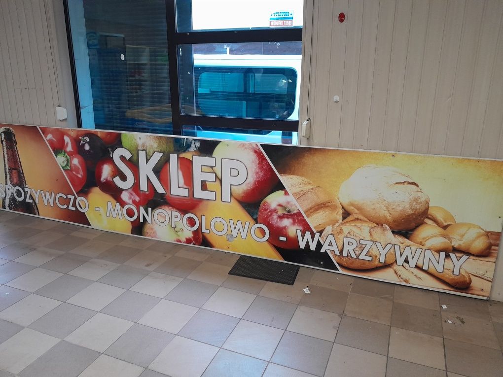 Reklama  szyld baner sklepu spożywczo monopolowy uniwersalne