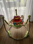Skoczek chodzik Fisher Price obrotowy grajacy