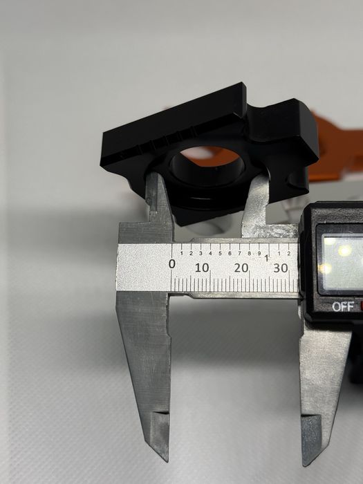 Блок регулювання натяжника для ланцюга