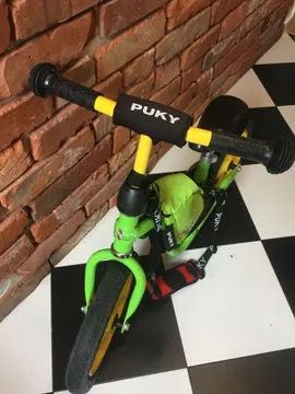 dziecięcy rower biegowy PUKY LR 1L 12 ze stopką  pas do noszenia torba