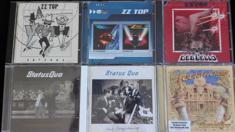 CDs Scorpions, AC/DC, ZZ Top, Bon Jovi, Status Quo e outros