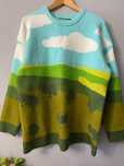 Sweter oversize góry niebo chmury krajobraz scenka wzory kolorowy