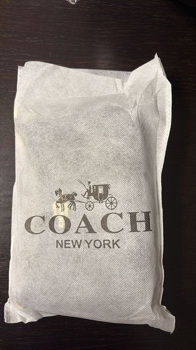 Mala Coach com duas alças e saco