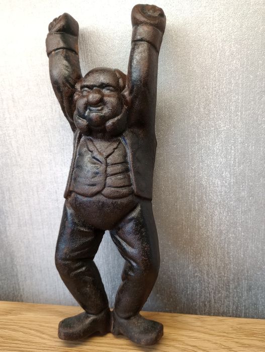 Stary żeliwny ściągacz do butów.