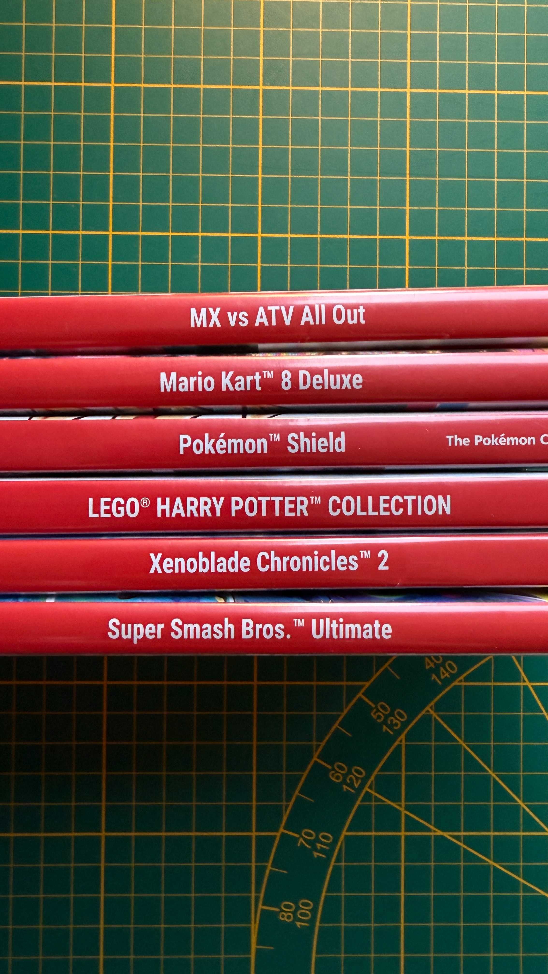 Nintendo Switch + gry (Mario Kart 8, Smash Bros., Pokemon Shield itp.)