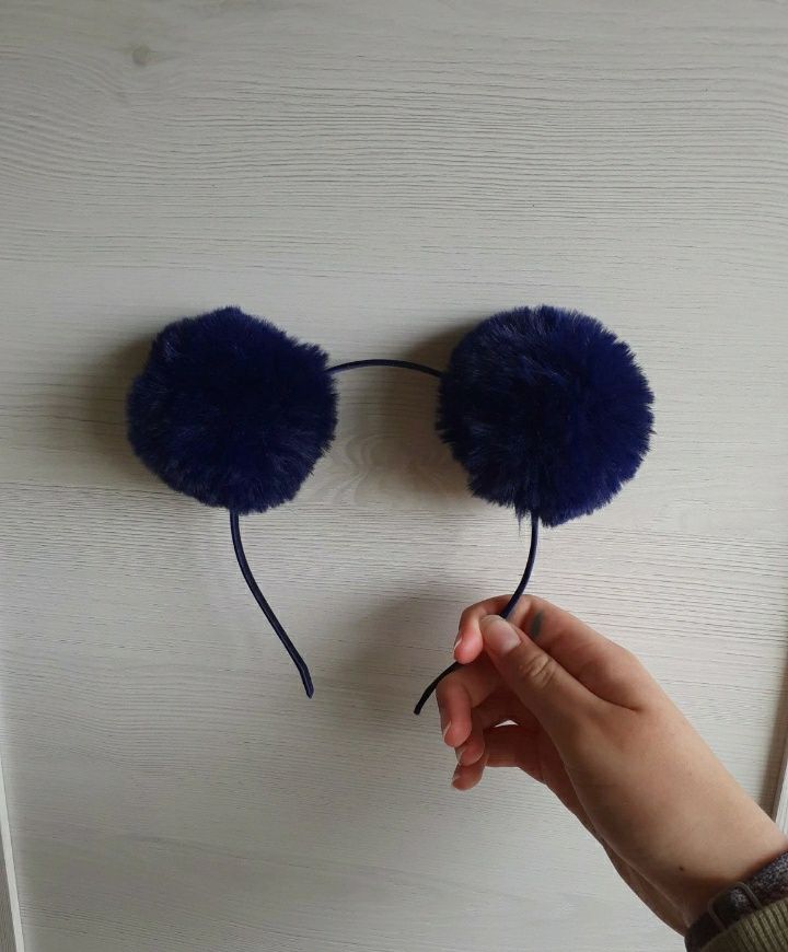 Bandolete com pom poms