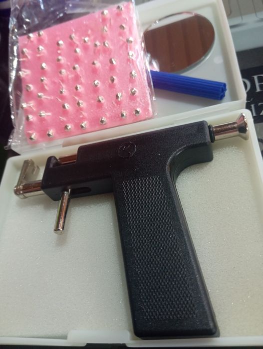 Pistola de brincos e piercings
