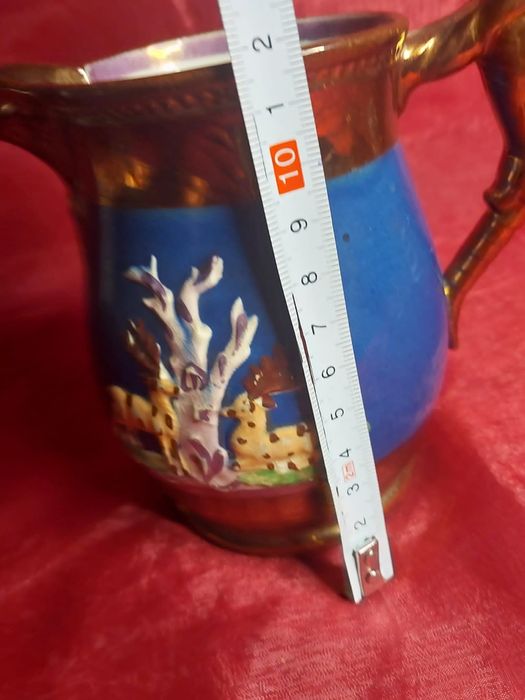 Miedziany dzban z lwen kryty politurą