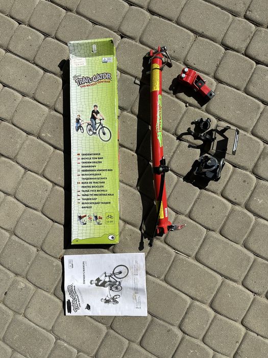 Trail-Gator drążek tandemowy, czerwony. Prowadnica do roweru Uchwyt