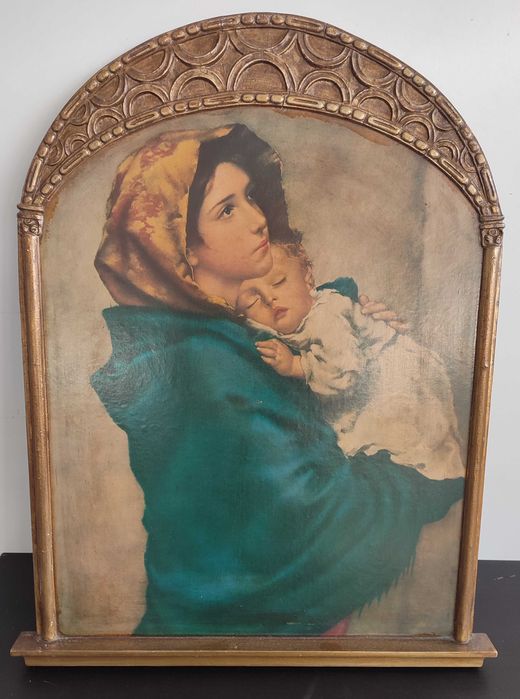 Quadro religioso com moldura dourada