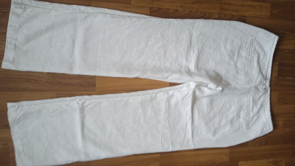 Білі широкі льняні брюки. we