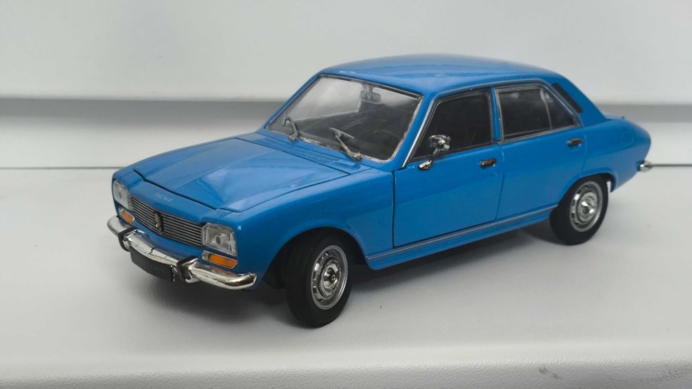 Модель, машинка Peugeot 504 1975 1.24 Welly