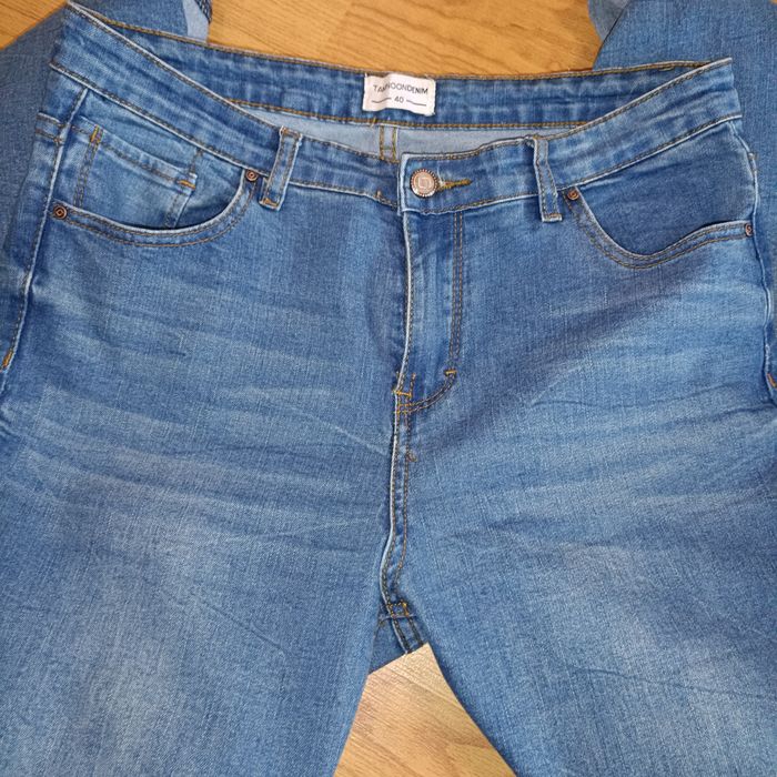 Пакетом джинси/штани жіночі