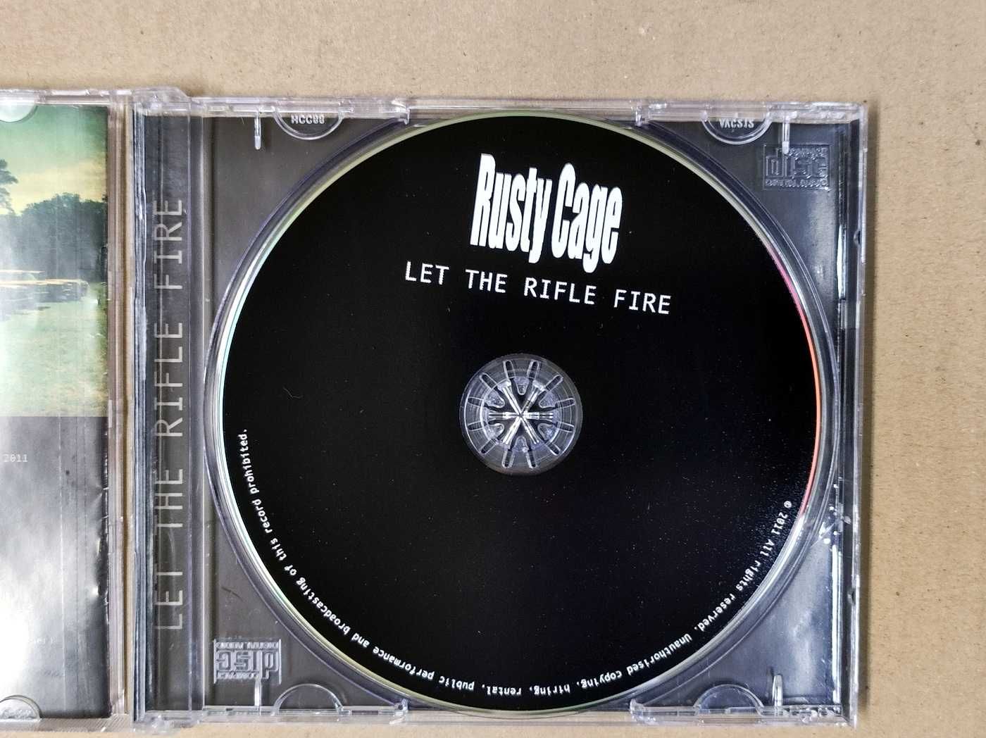 Rusty Cage — Let The Rifle Fire CD jak nowa 2011