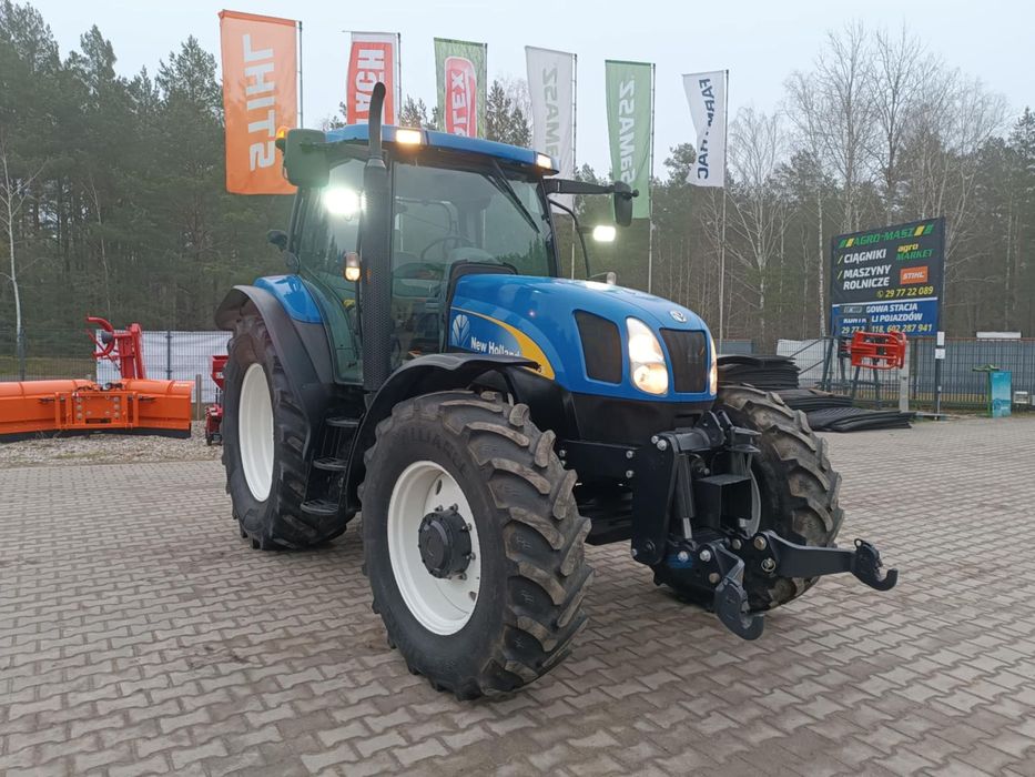 New Holland TS135A  New Holland TS135A przedni WOM/TUZ
