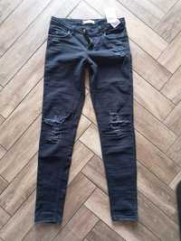 Jeansy firmy Levi's 710 super skiny z przetarciami rozmiar m