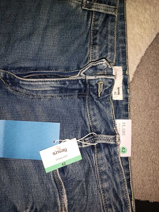 Nowe jeansy dzwony mid waist 42