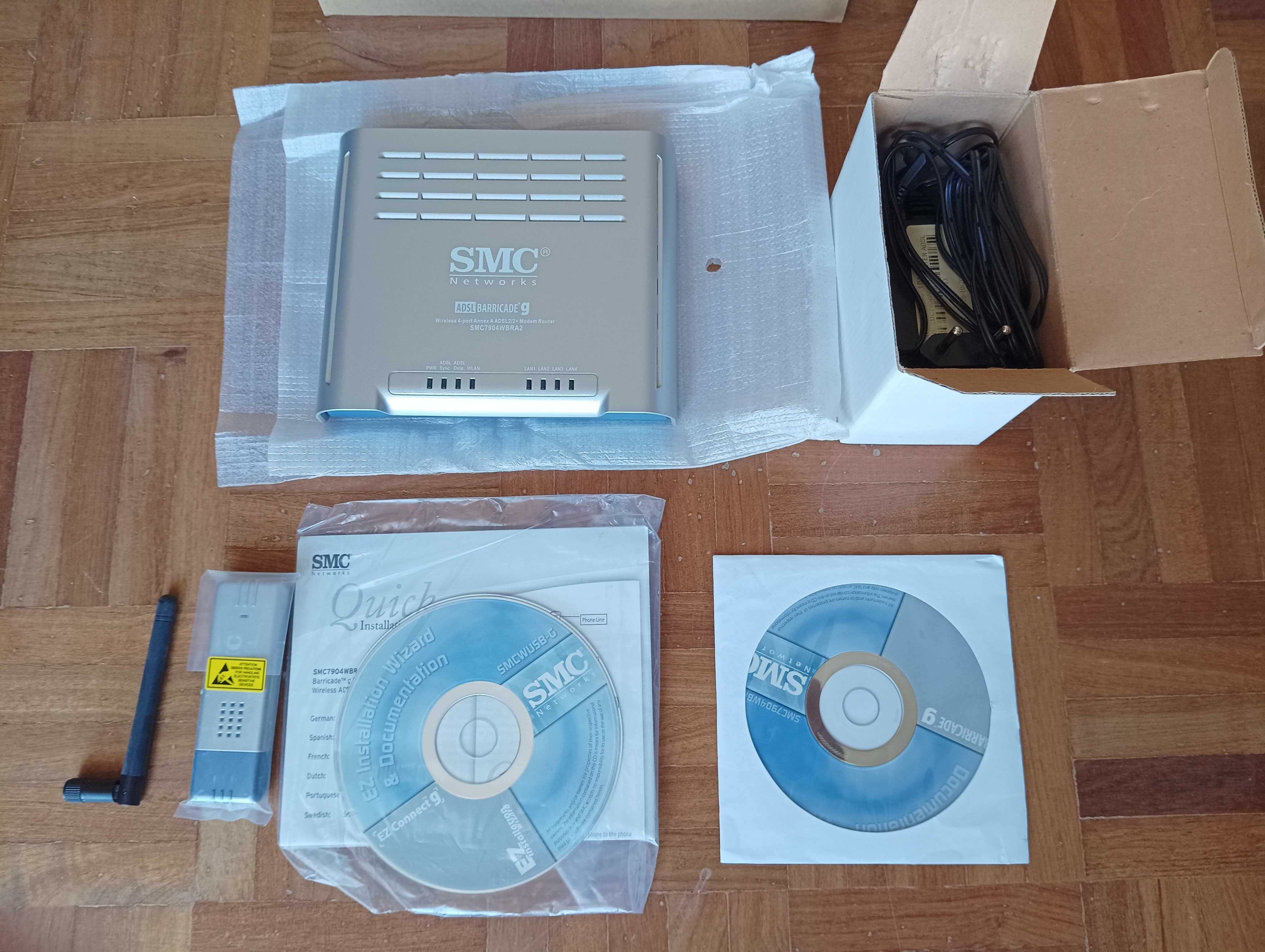 Router Modem ADSL 2+, Marca SMC, e Pen Wireless USB