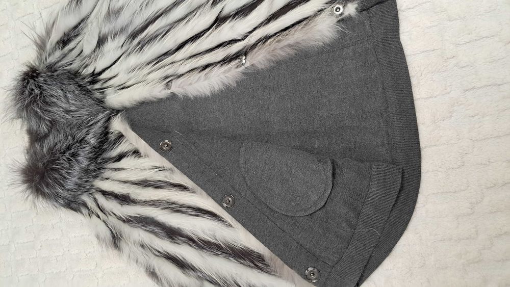 Жіноче хутряне пончо