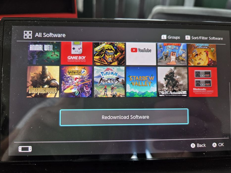 Switch OLED wersja Mario + akcesoria + gry