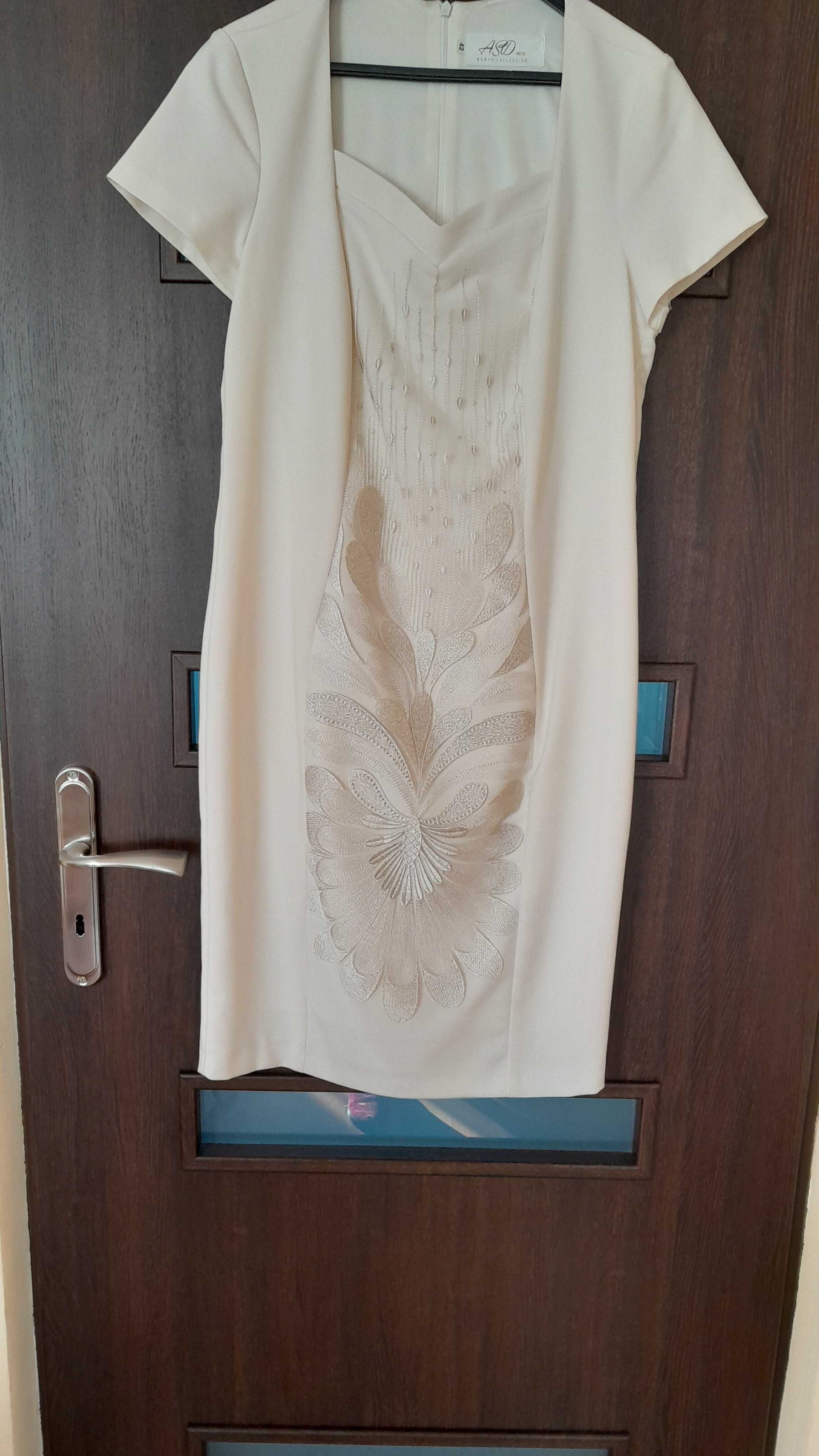 elegancka  kremowa  sukienka ze śliczną wstawką  rozm.40/42