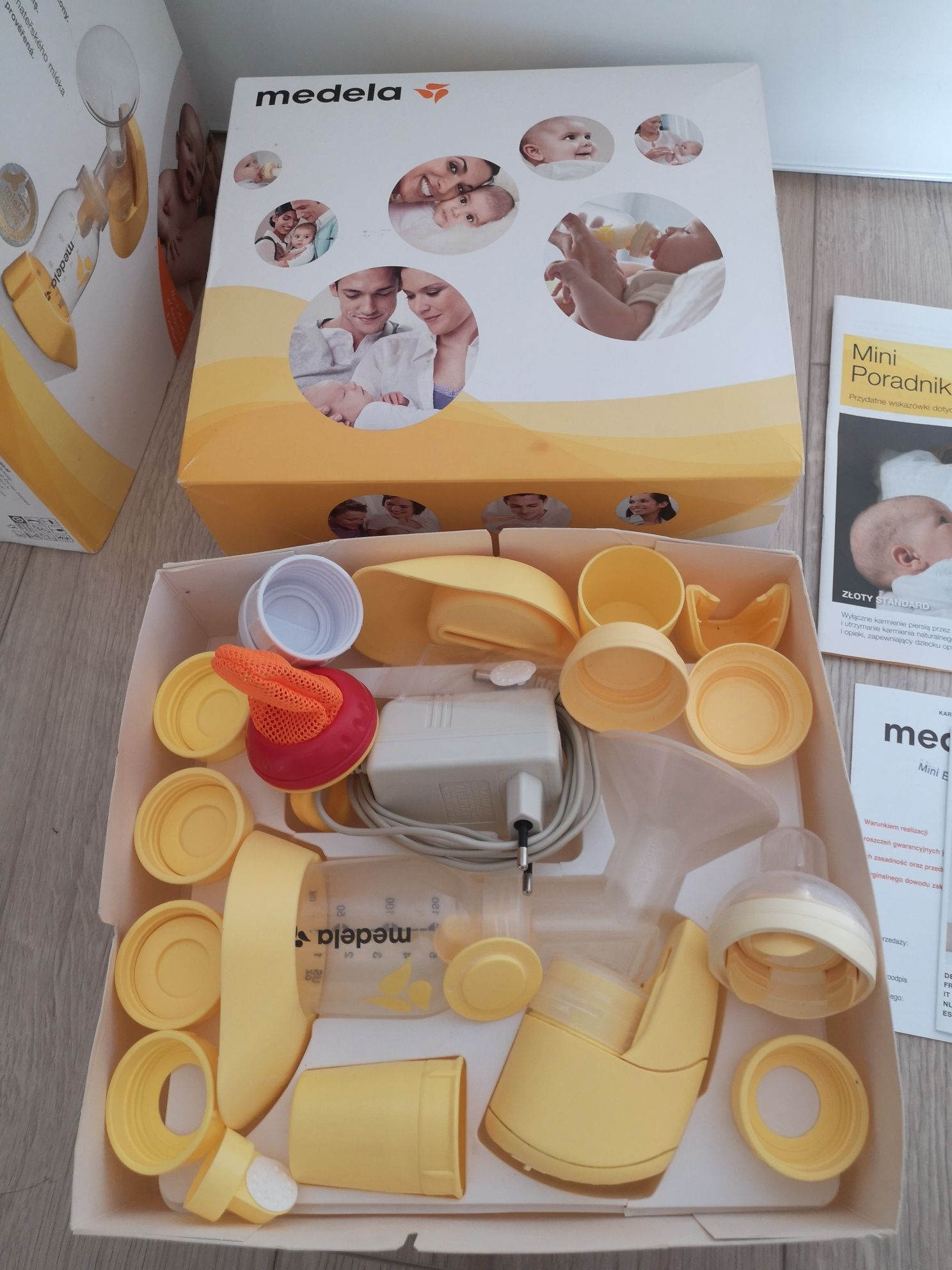 Laktator Medela Mini Electric, akcesoria, nowy smoczek, butelka