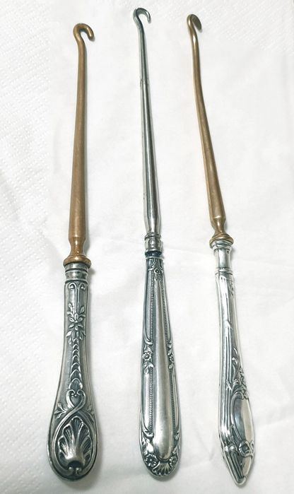 Antigas abotoadeiras com pega em prata contrastada -  Preço cada 35€