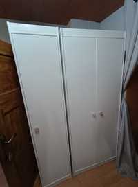 Dwie szafy, pomalowane na biało