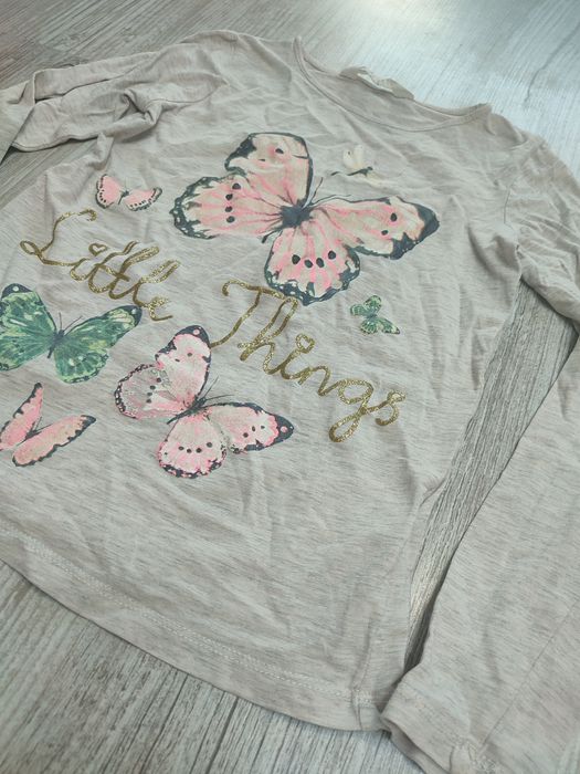 H&M 122 128 bluzka dziewczęca długi rękaw motyle grafika elastan