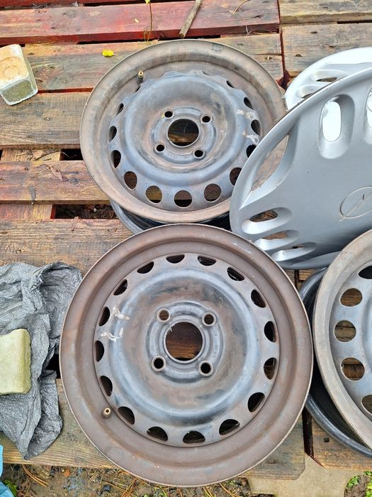 Felgi stalowe GM 13 cali z kołpakami Opel Astra F