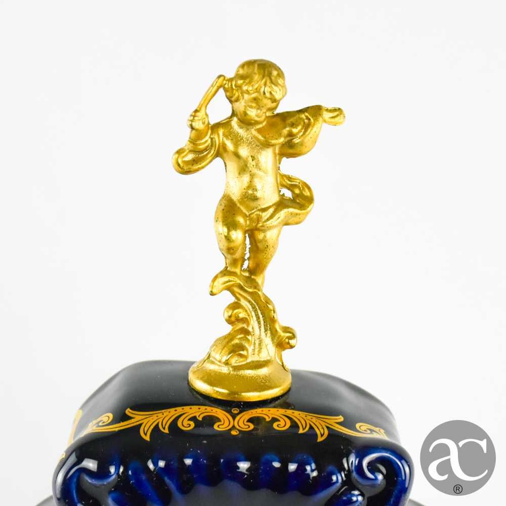 Relógio de lareira em porcelana Limoge e metal dourado