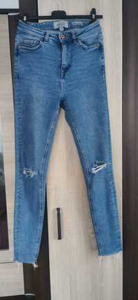 Spodnie jeansy rurki z dziurami Haille