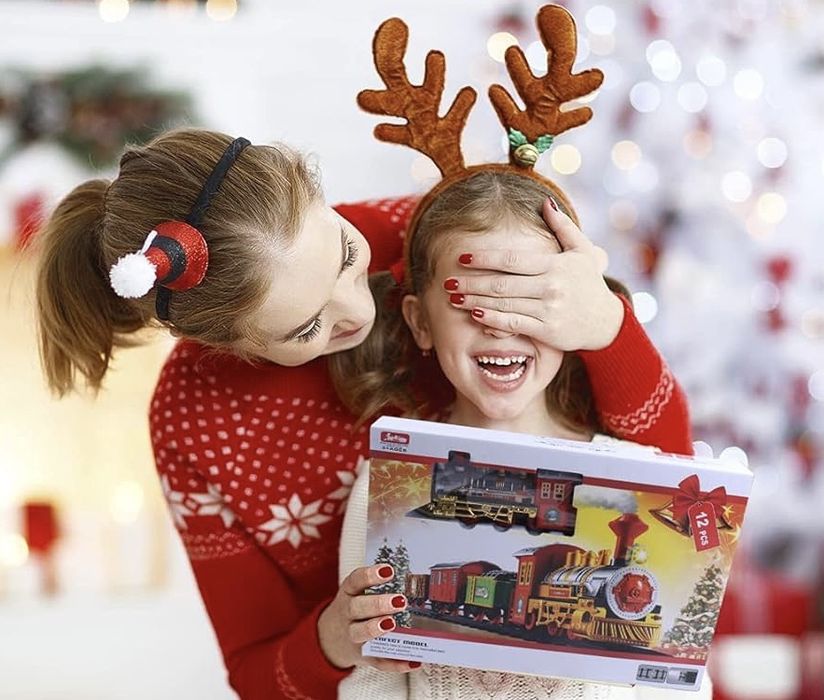 Дитяча різдвяна залізниця поїзд що світиться та гуде святкова іграшка