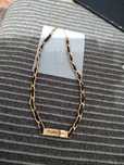 Colar Forever dourado e preto