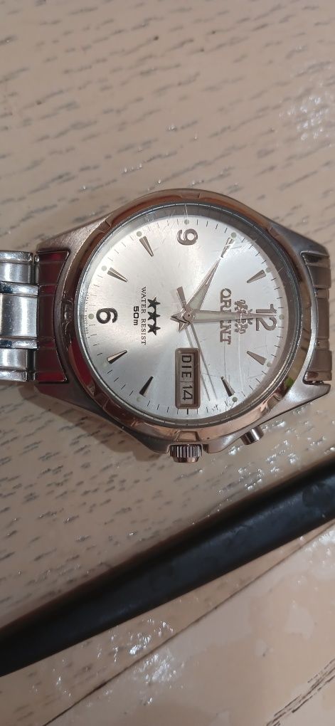 Orient ,наручний з підзоводом годинник