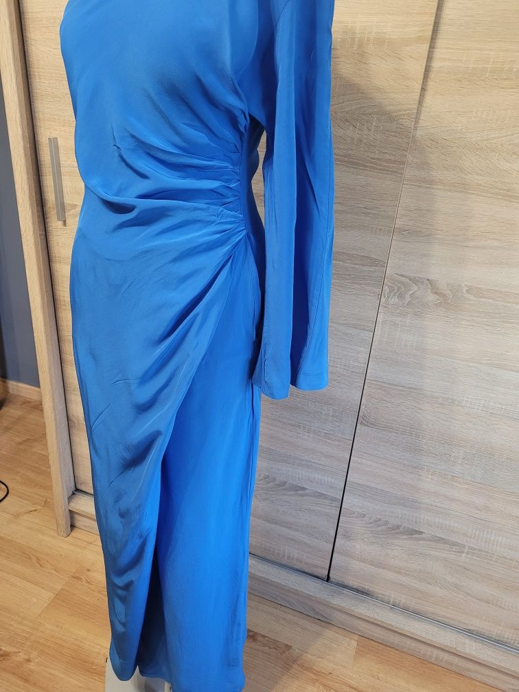 Elegancki kombinezon damski z szerokimi nogawkami